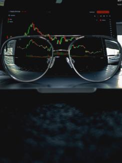 a pair of glasses sitting on top of a laptop computer by Nimisha Mekala courtesy of Unsplash.